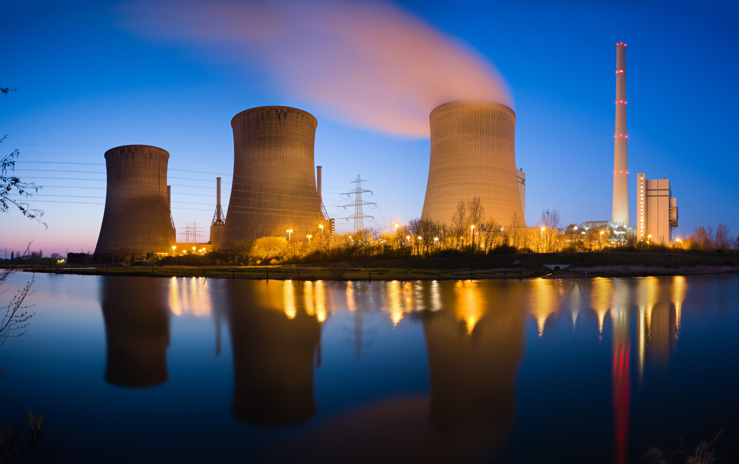 Nuclear power plant on a river at night